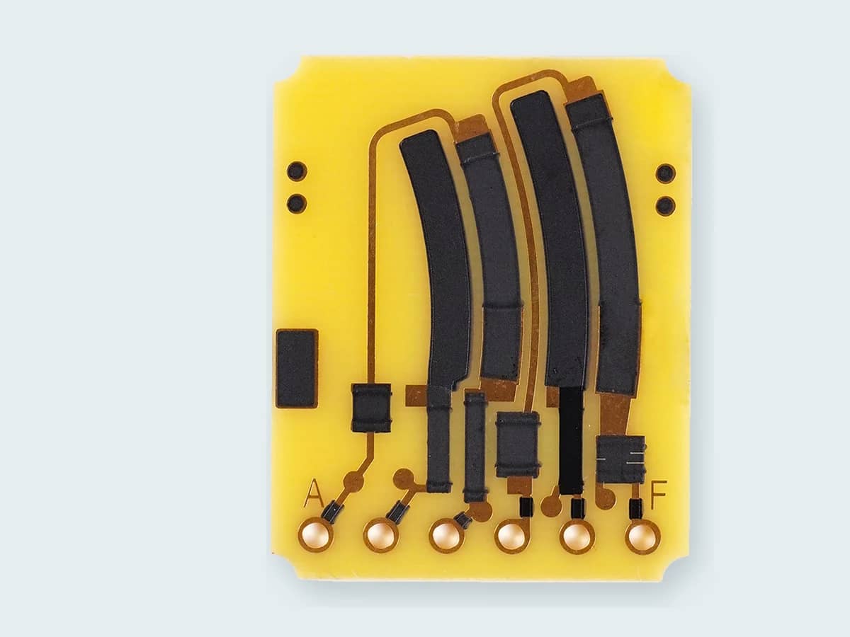 Verified FR4 printed carbon resistor PCB sample with black functional tracks